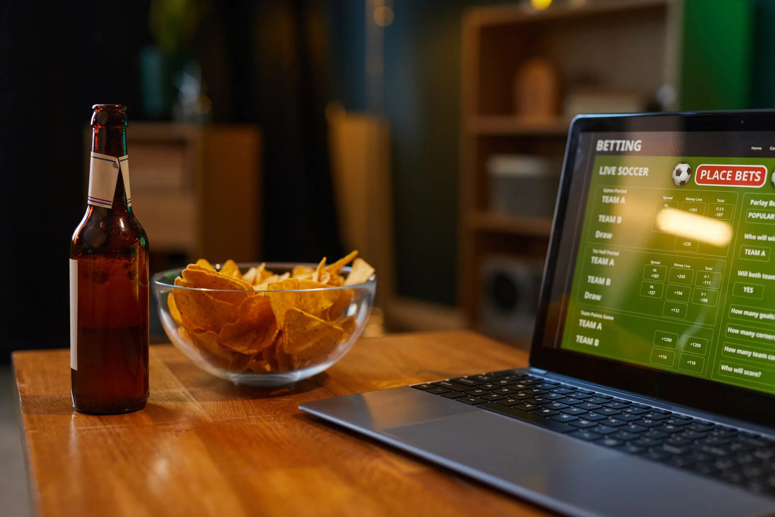 Watching Live Soccer Game on Laptop with Snacks