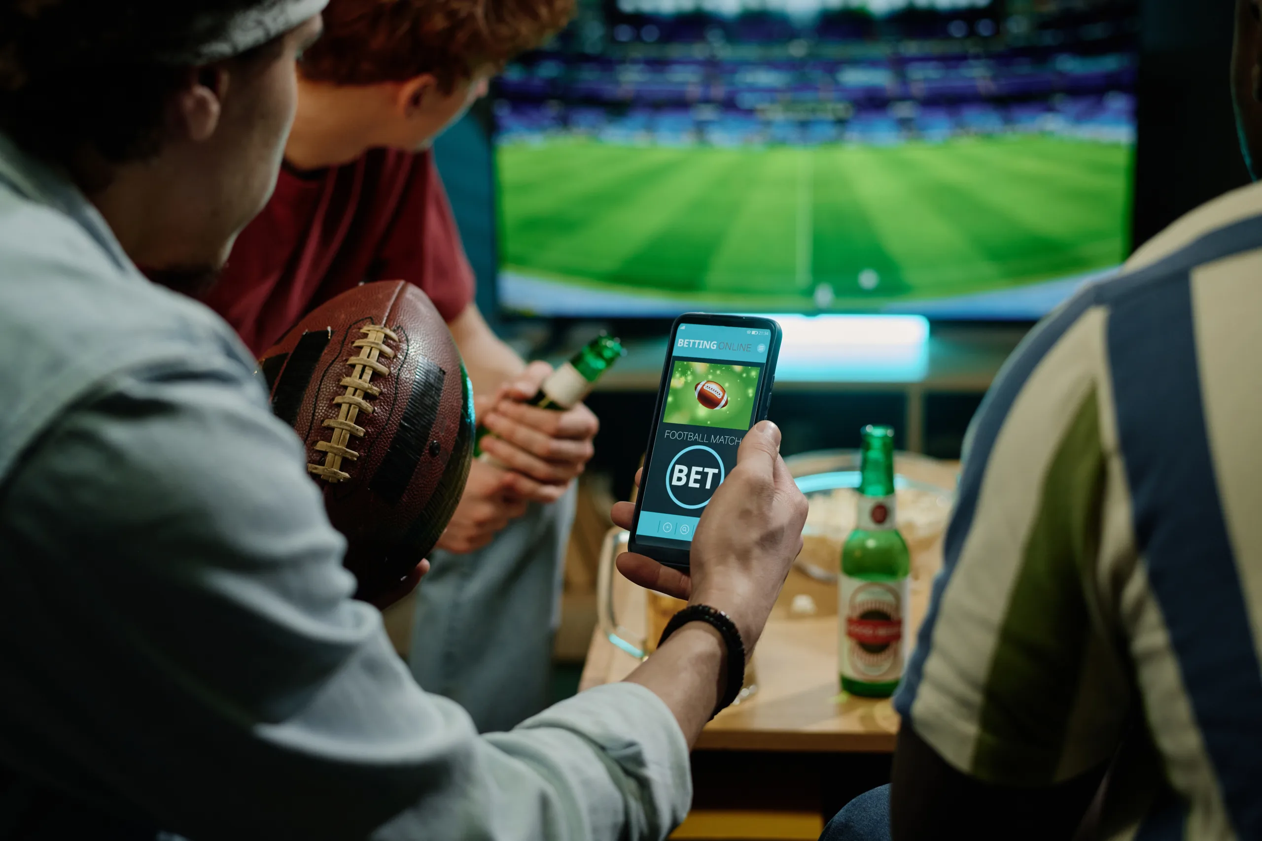 Young Men Betting During Football Match