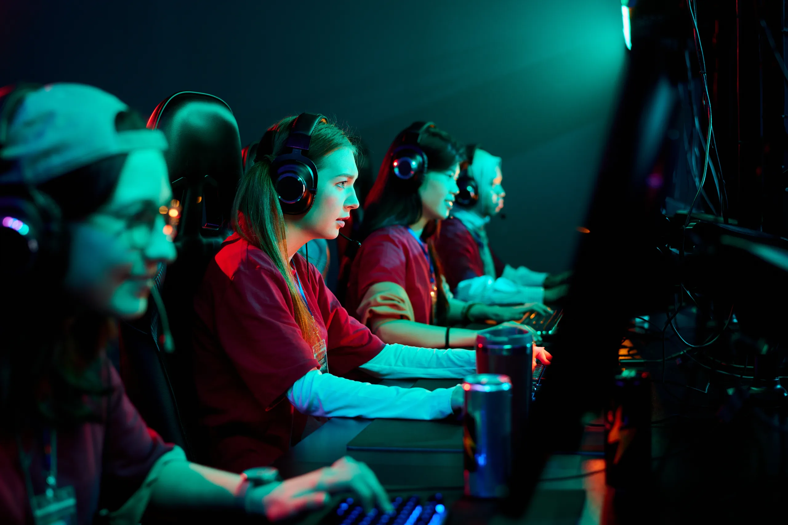 Teenage Caucasian Girls Team Playing Esports Video Game in Gaming Arena