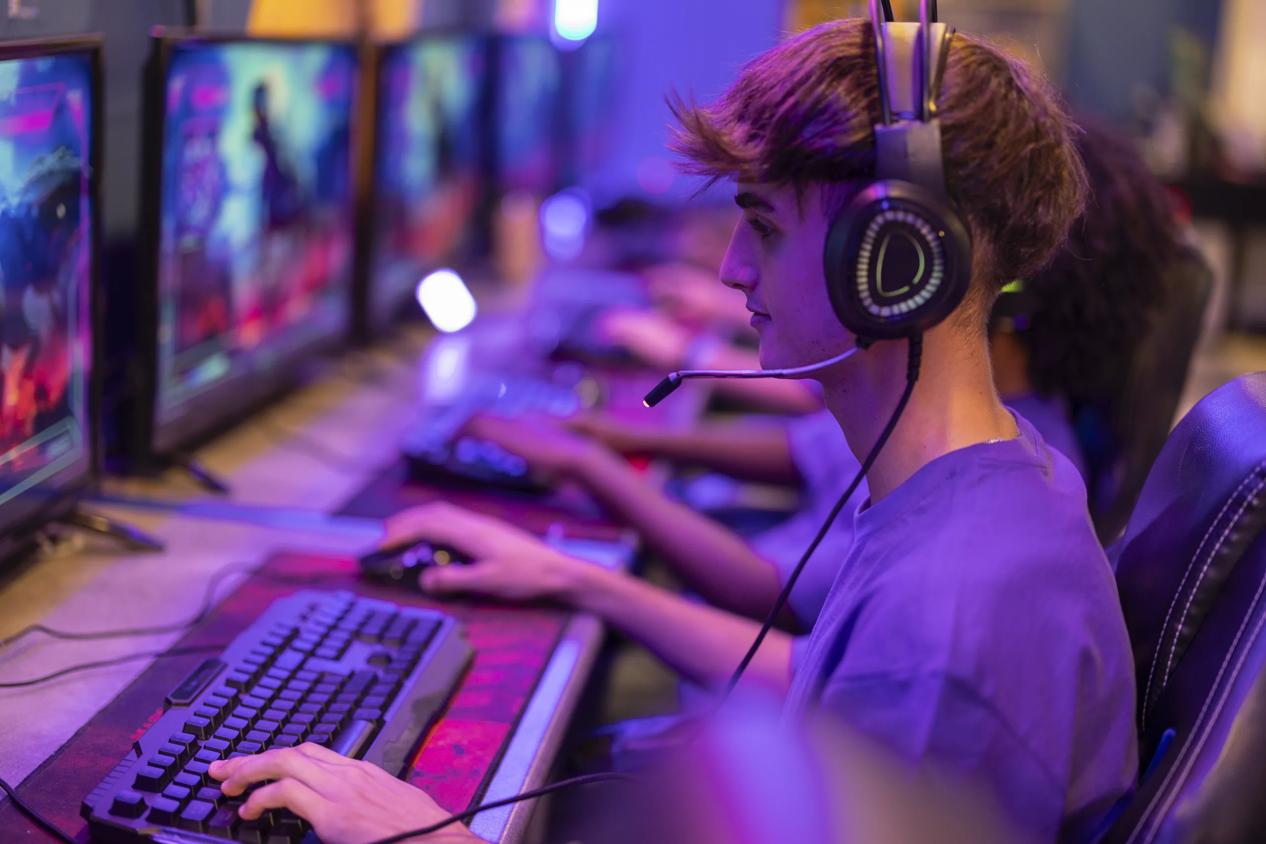 Professional gamer playing in online video game tournament