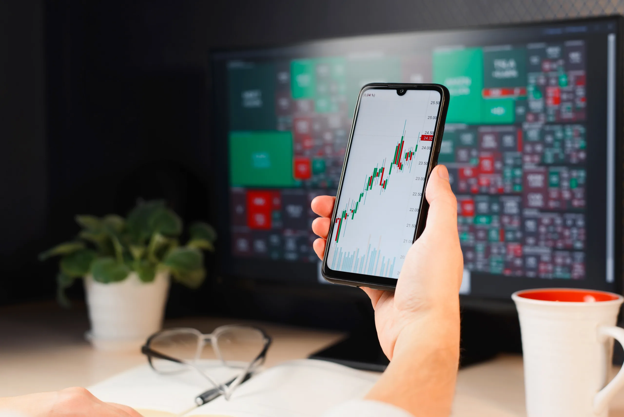 Business and finance, investment and trading. Close-up of businessman trader using mobile application to analyze stock market, crypto exchange. Profit growth and loss graph on smartphone screen