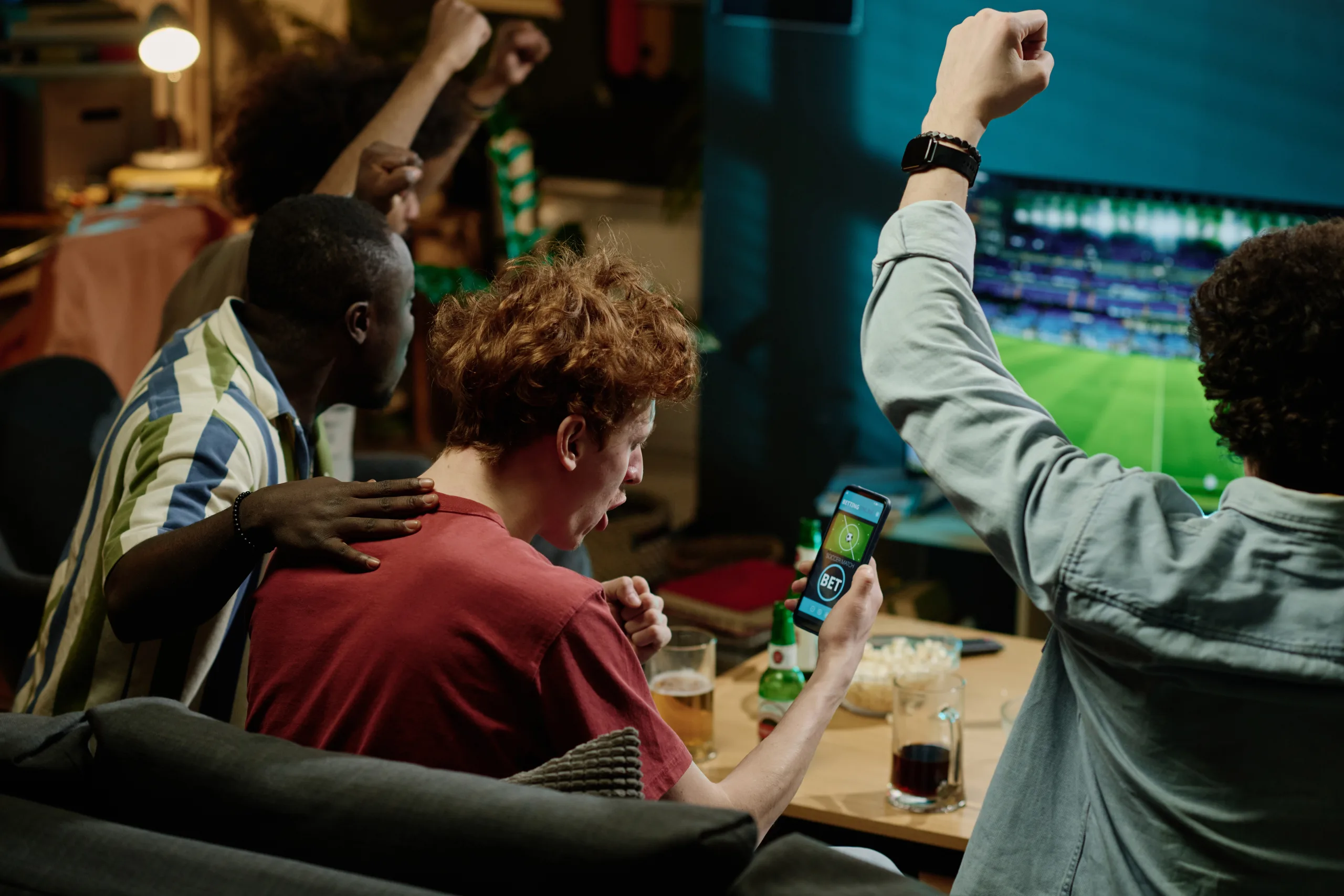 Happy Soccer Fans Watching Match On TV