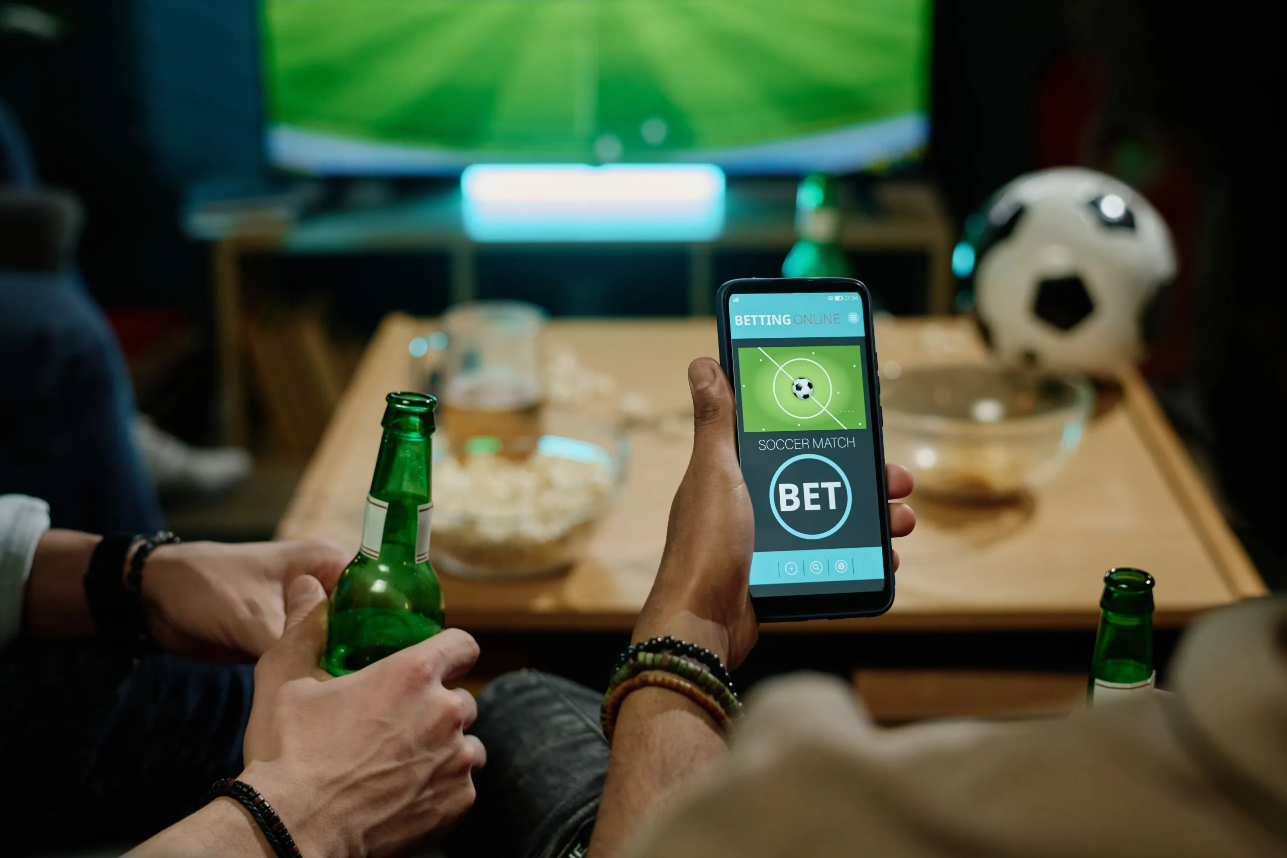 Unrecognizable Man Betting On Soccer Team Using App